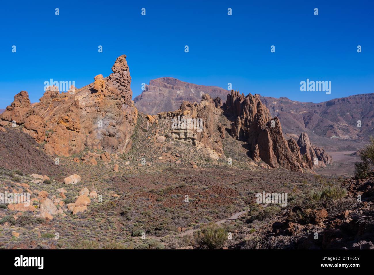 Downhill path in the Roques de Gracia and the Roque Cinchado in the natural area of Teide in Tenerife, Canary Islands Stock Photo