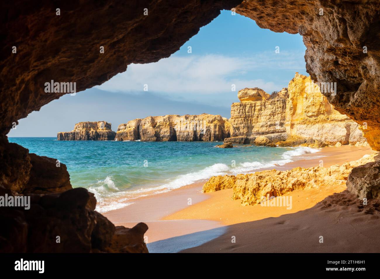 A natural summer beach cave at Praia da Coelha, Algarve, Albufeira. Portugal Stock Photo