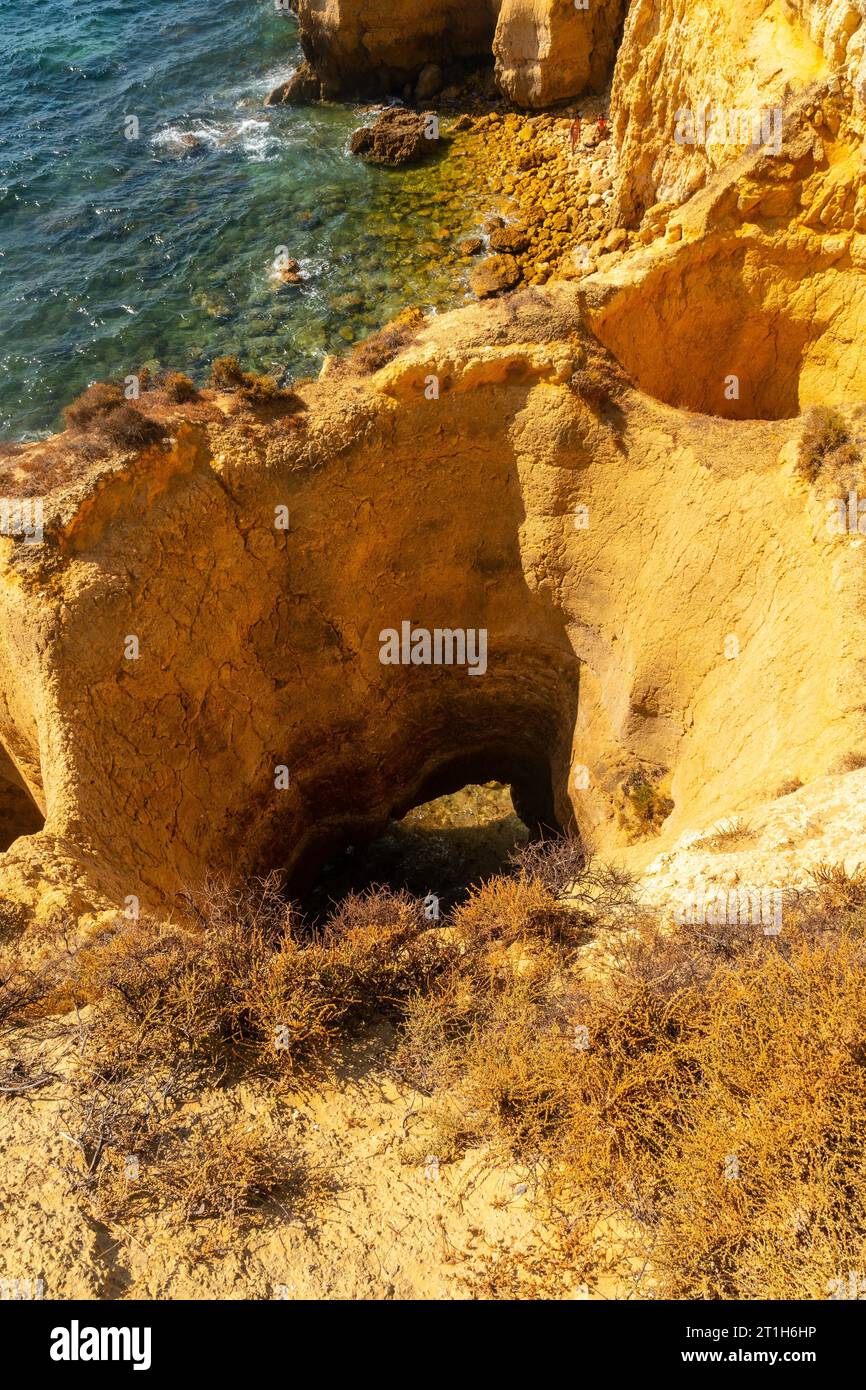 Natural holes in the beautiful coastline in summer at Praia da Coelha, Algarve, Albufeira. Portugal Stock Photo