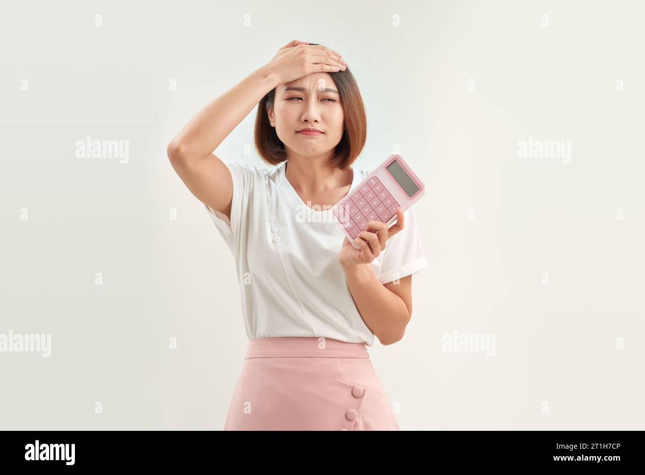 young attractive asian woman having an electronic calculator Stock Photo