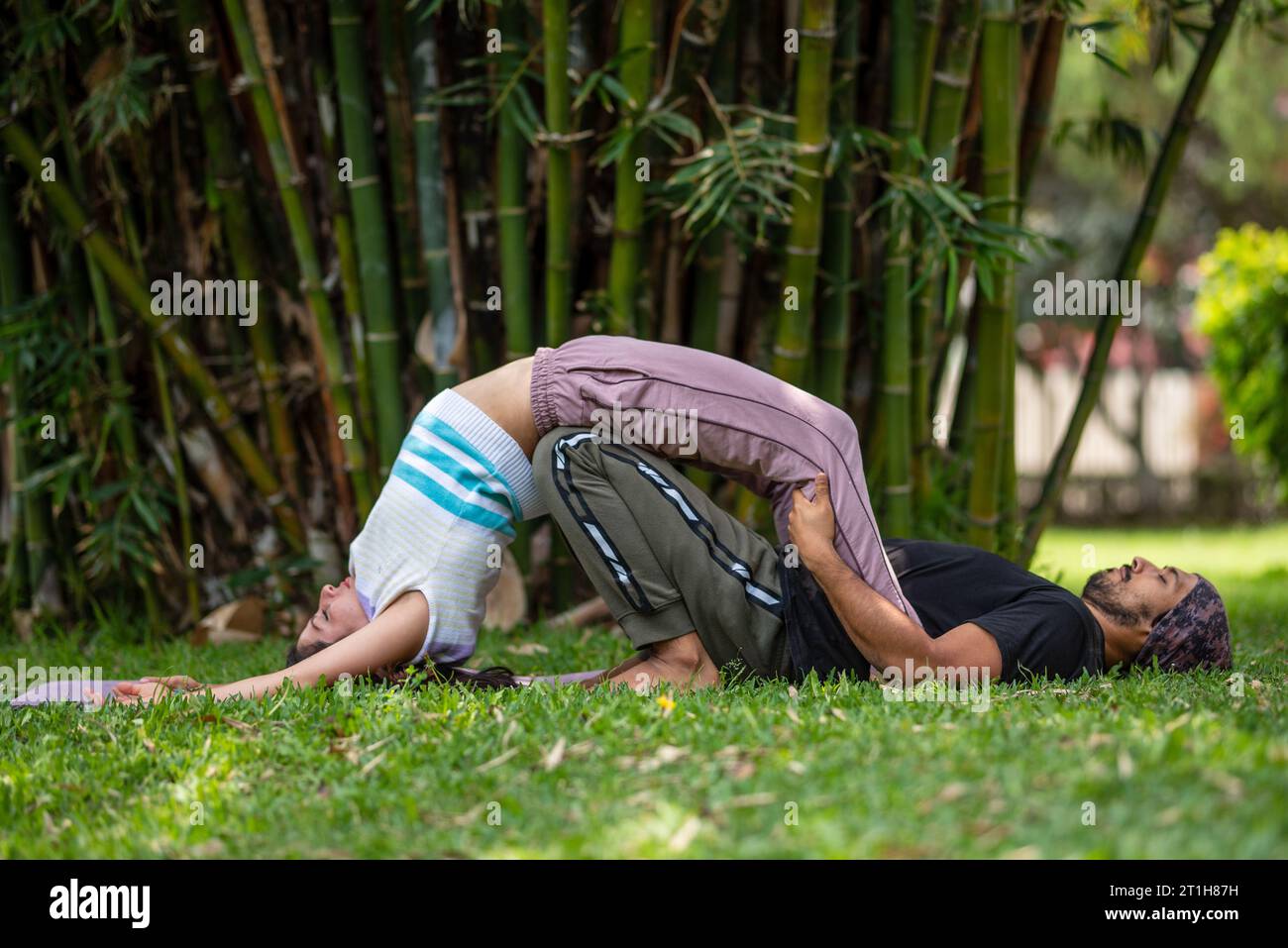 Thai Massage Therapy Session Outdoors With Bamboo Background Man And