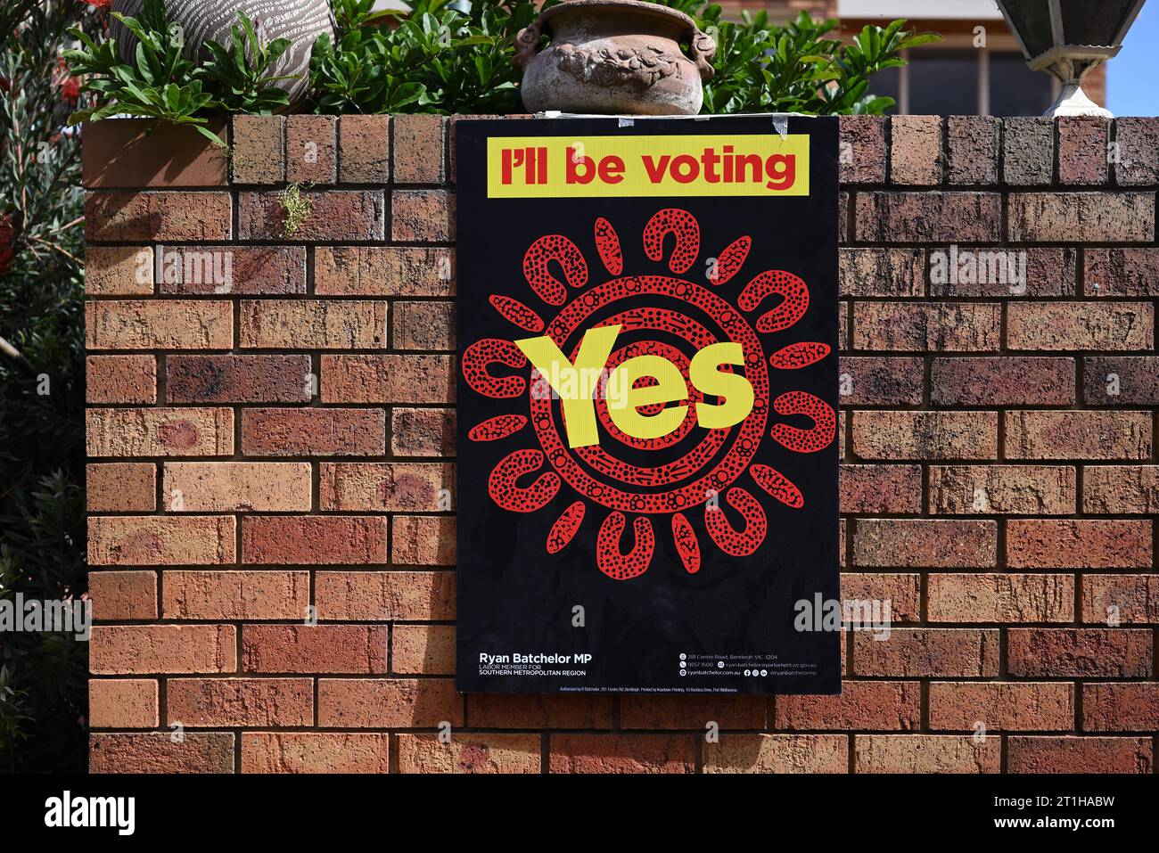 I'll be voting yes sign, with Aboriginal style design, on a brick wall, part of the indigenous voice to parliament referendum campaign Stock Photo