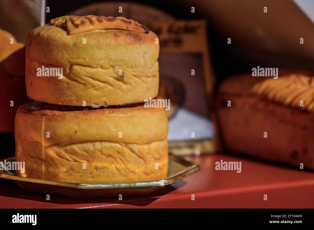 Foie gras or duck liver pate in a pastry, meat pie on display at a