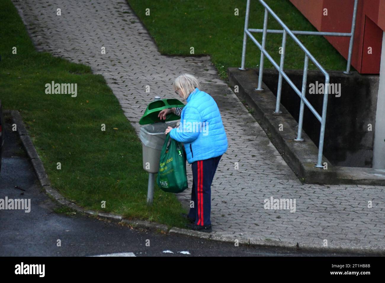 Copenhagen, Denmark /14 October. 2023/.Person seeks empty bottle and can from wste dustpen for recycle for cash in Kastrup danish capital. Photo.Francis Joseph Dean/Dean Pictures Credit: Imago/Alamy Live News Stock Photo