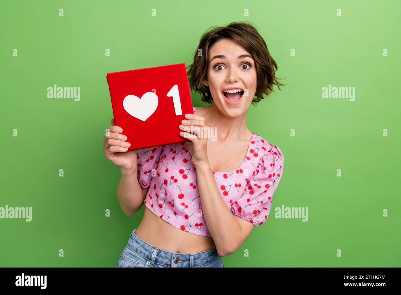 Photo of ecstatic overjoyed woman dressed pink blouse holding like icon ...