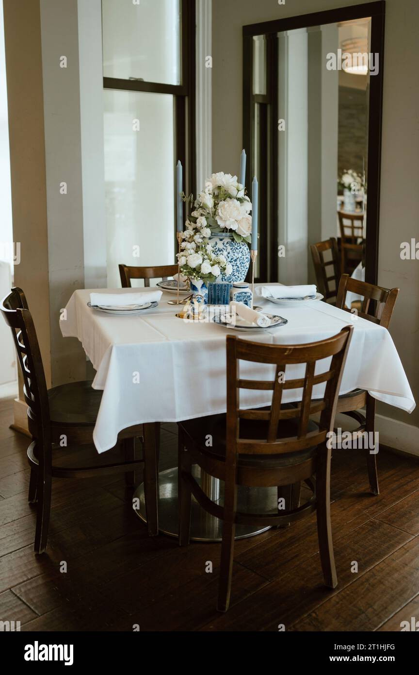 A traditional wedding reception with a beautiful blue china dinnerware ...