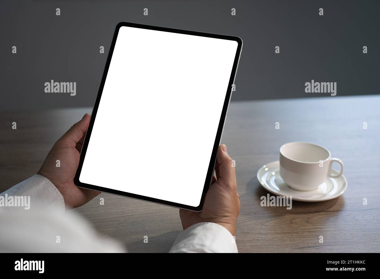 Digital tablet computer close up man using tablet hands man multitasking with isolated screen Stock Photo