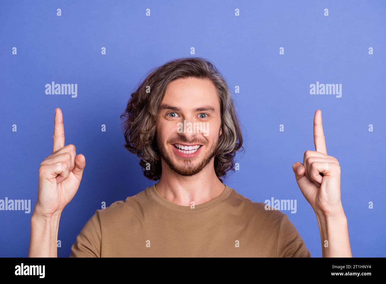 Portrait of toothy beaming guy with long haircut wear stylish t-shirt ...