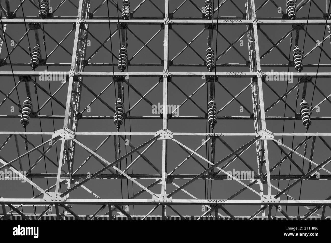 Overhead High Voltage Electrical Power Transmission Cables And Insulators On An Pylon