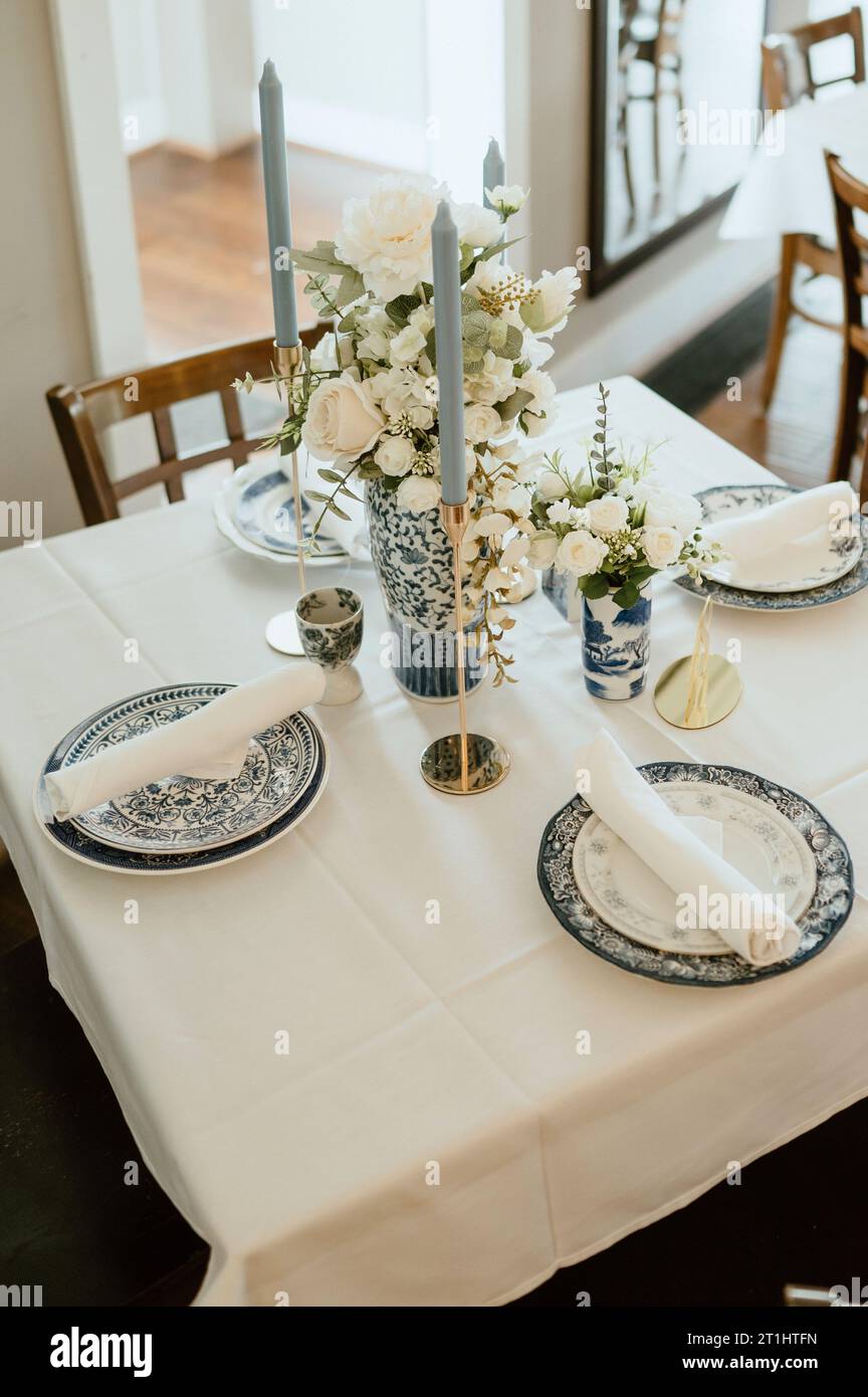 A traditional wedding reception with a beautiful blue china dinnerware ...