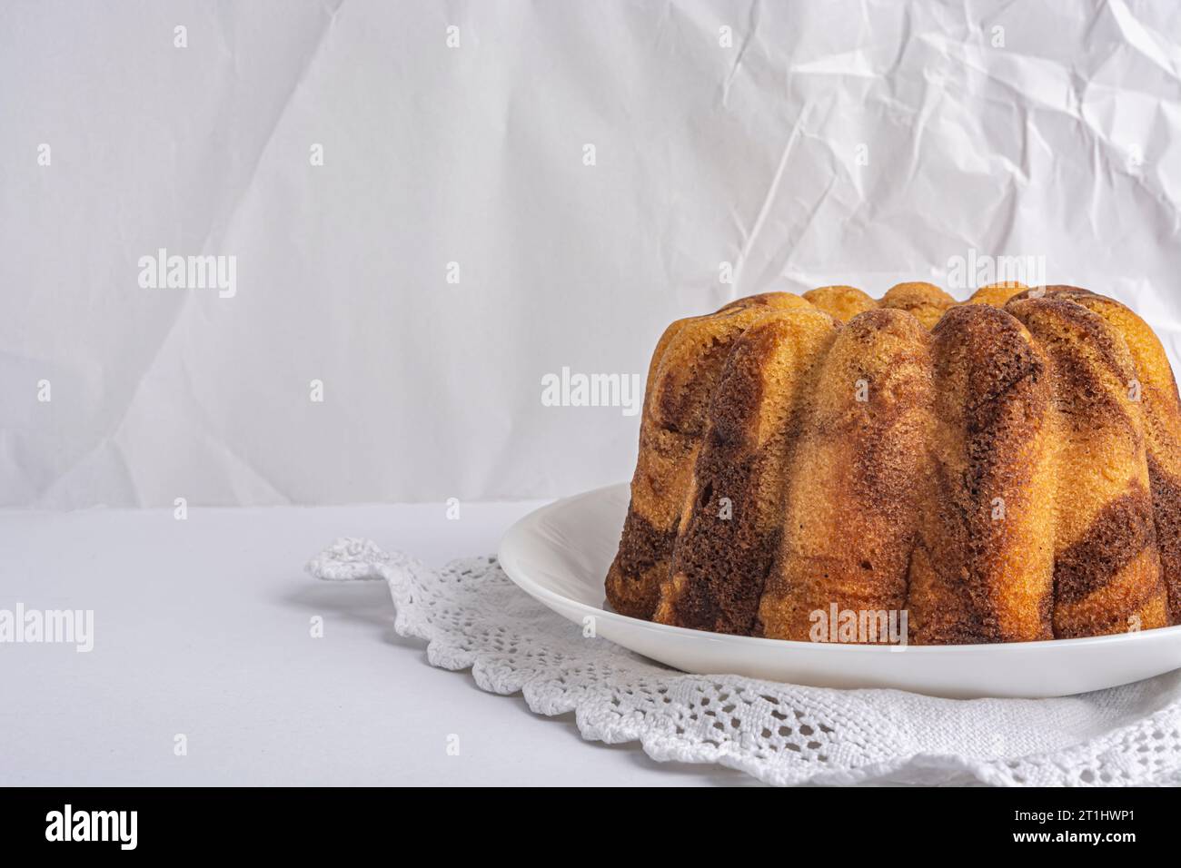 chocolate cupcake on a white plate close-up Stock Photo