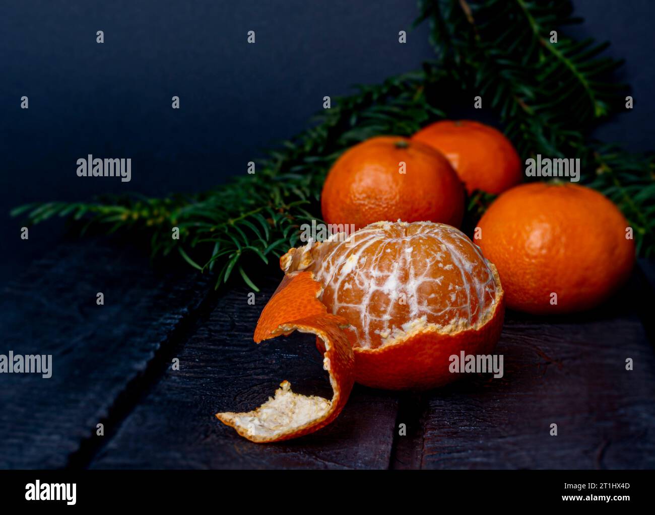 mandarins on a dark blurred background Stock Photo