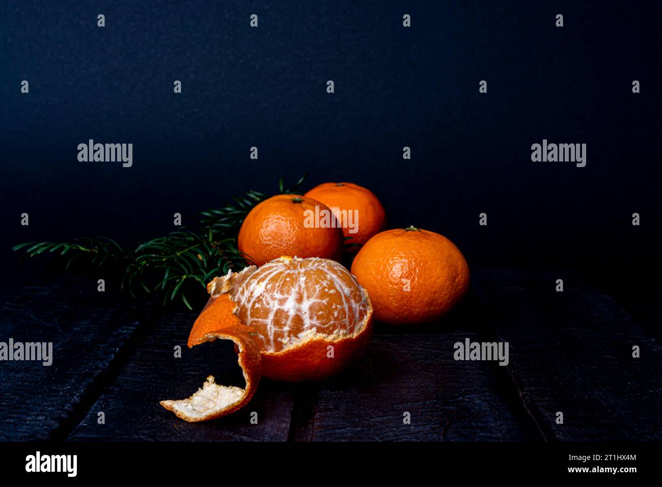 mandarins on a dark blurred background Stock Photo