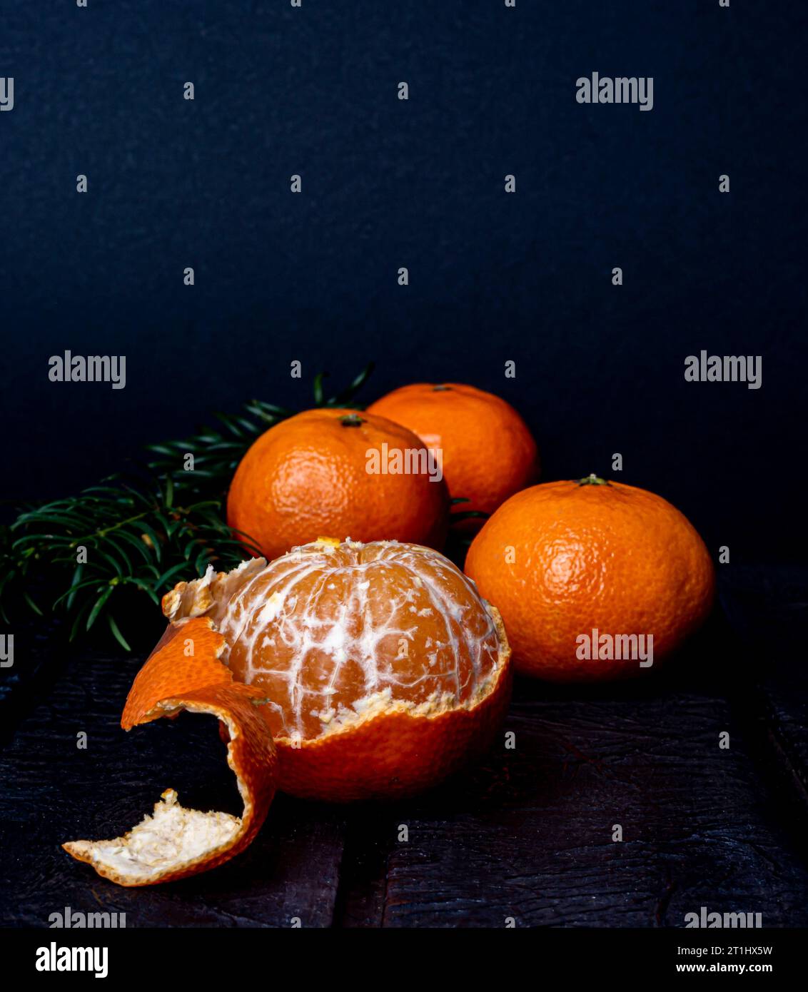 mandarins on a dark blurred background Stock Photo