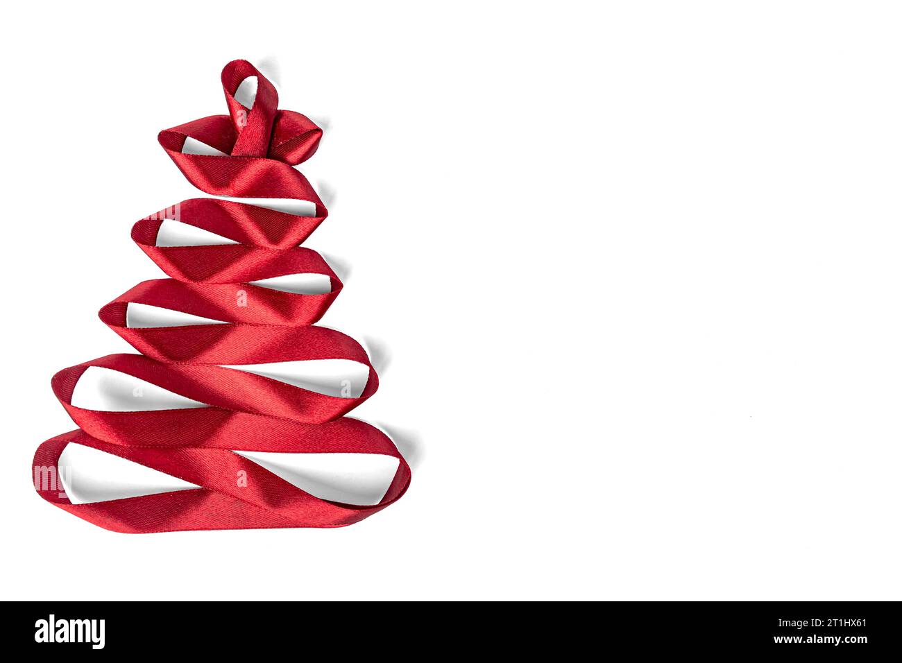Christmas tree made of satin red ribbon on white background Stock Photo ...