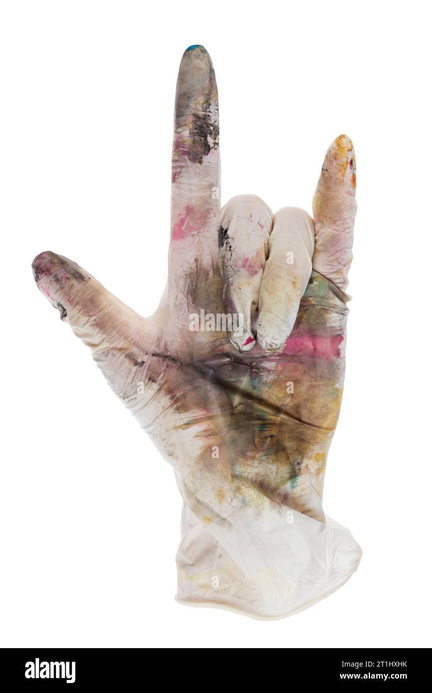 Heavy metal fingers in a rubber glove stained with paints. Isolated on