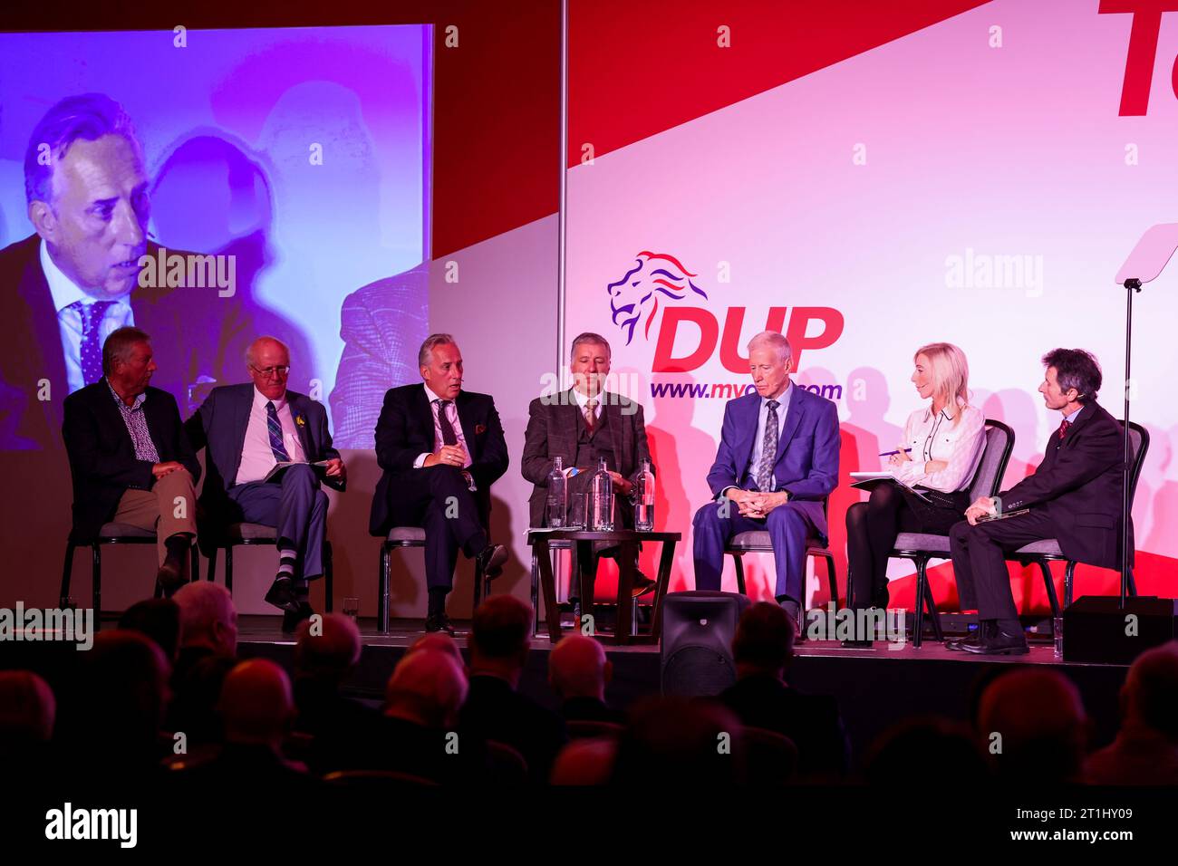 (from left) Sammy Wilson MP, Jim Shannon MP, Ian Paisley Jnr MP, Paul Girvan MP, Gregory Campbell MP, and Carla Lockhart MP with Mark Devenport chairing a discussion during the DUP party' conference at the Crowne Plaza Hotel in Belfast. Picture date: Saturday October 14, 2023. Stock Photo