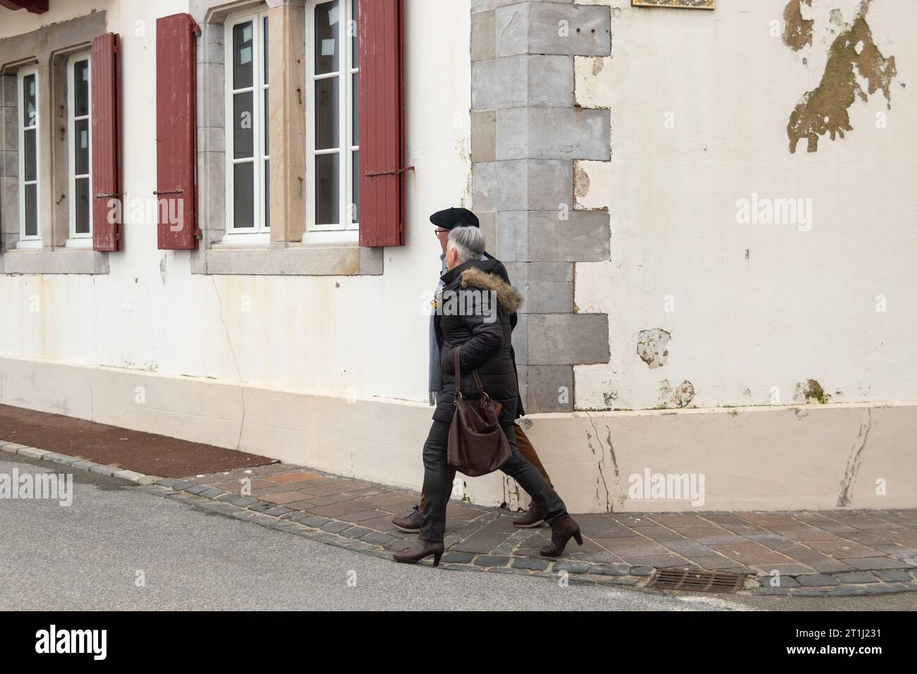 couple walking in the saint jean de luz streets, france Stock Photo