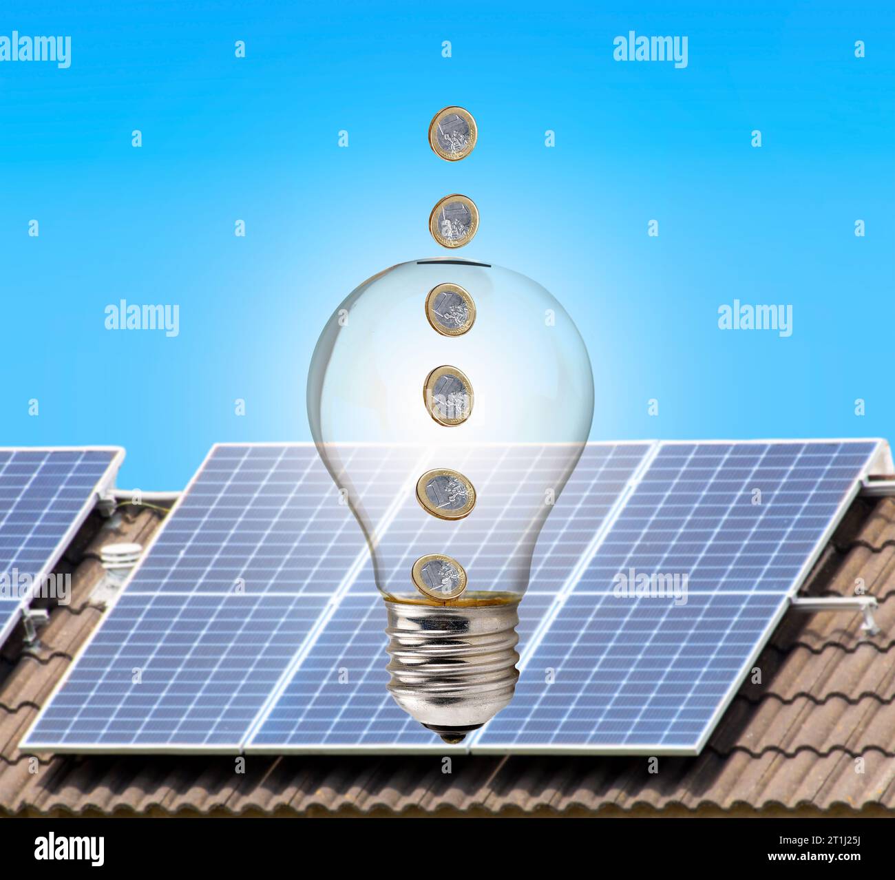 Money inside a light bulb with solar panel in the background Stock Photo
