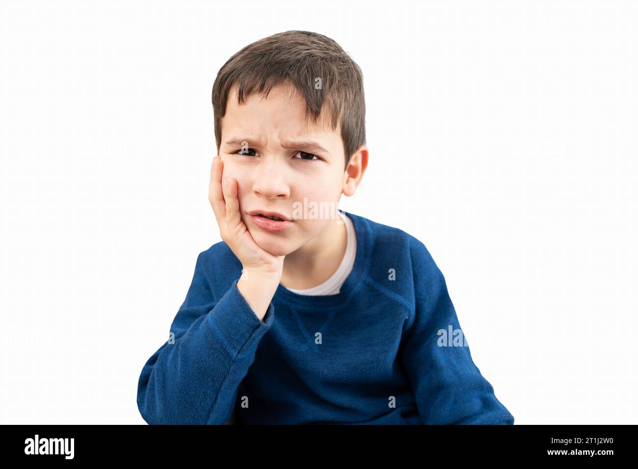 Stressed child complaining suffering toothache with white background ...