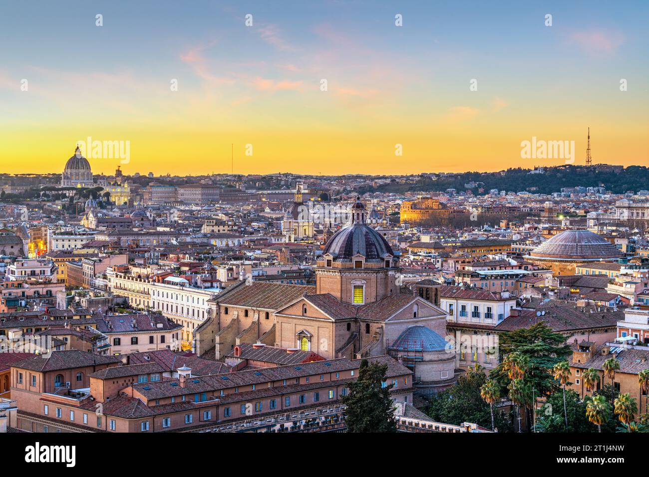 Rome, Italy rooftop cityscape with the Pantheon, Castel Sant'Angelo, the Vatican, and other historic landmarks at dusk. Stock Photo