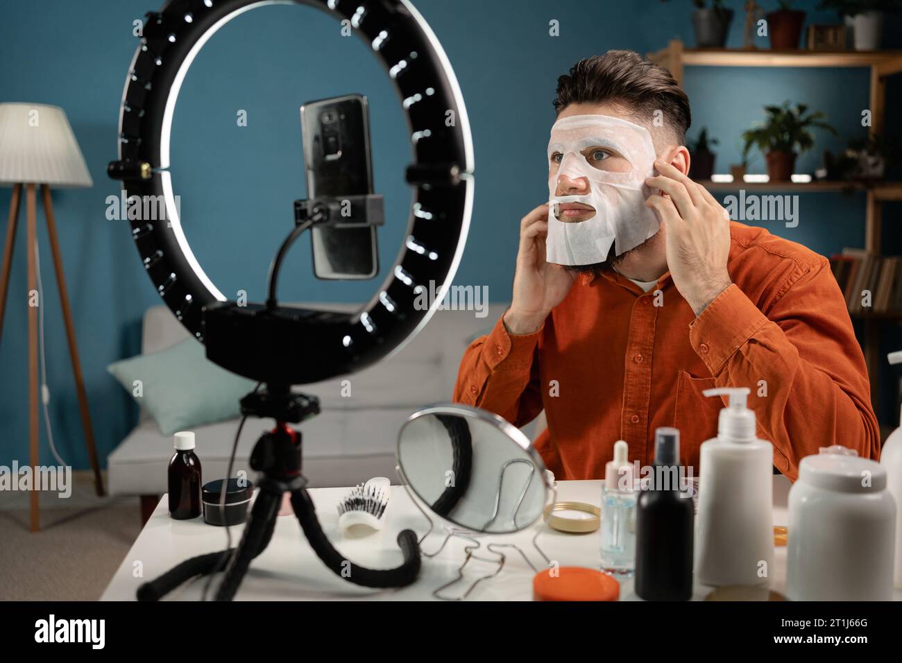 Young man uses cosmetic mask hi-res stock photography and images - Alamy