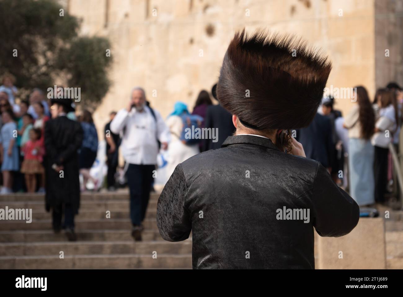 Back view of an Orthodox Jewish man Hasidim with a large fur hat and in a black suit Stock Photo