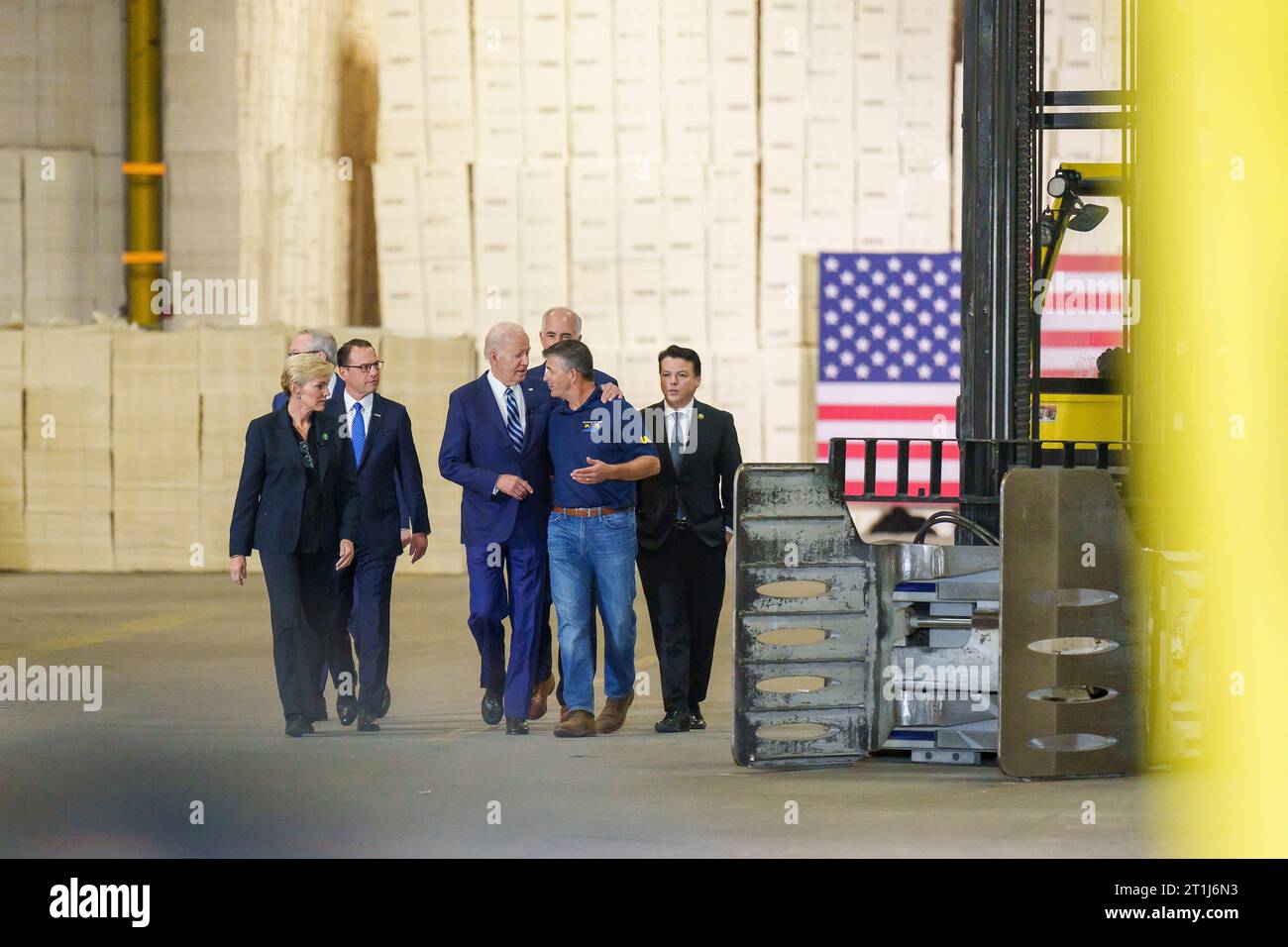 Philadelphia, United States. 13th Oct, 2023. U.S. President Joe Biden, center, walks with union workers and company executives announcing funding for regional clean energy hubs during an event at the at Tioga Marine Terminal, October 13, 2023 in Philadelphia, Pennsylvania. Credit: Adam Schultz/White House Photo/Alamy Live News Stock Photo