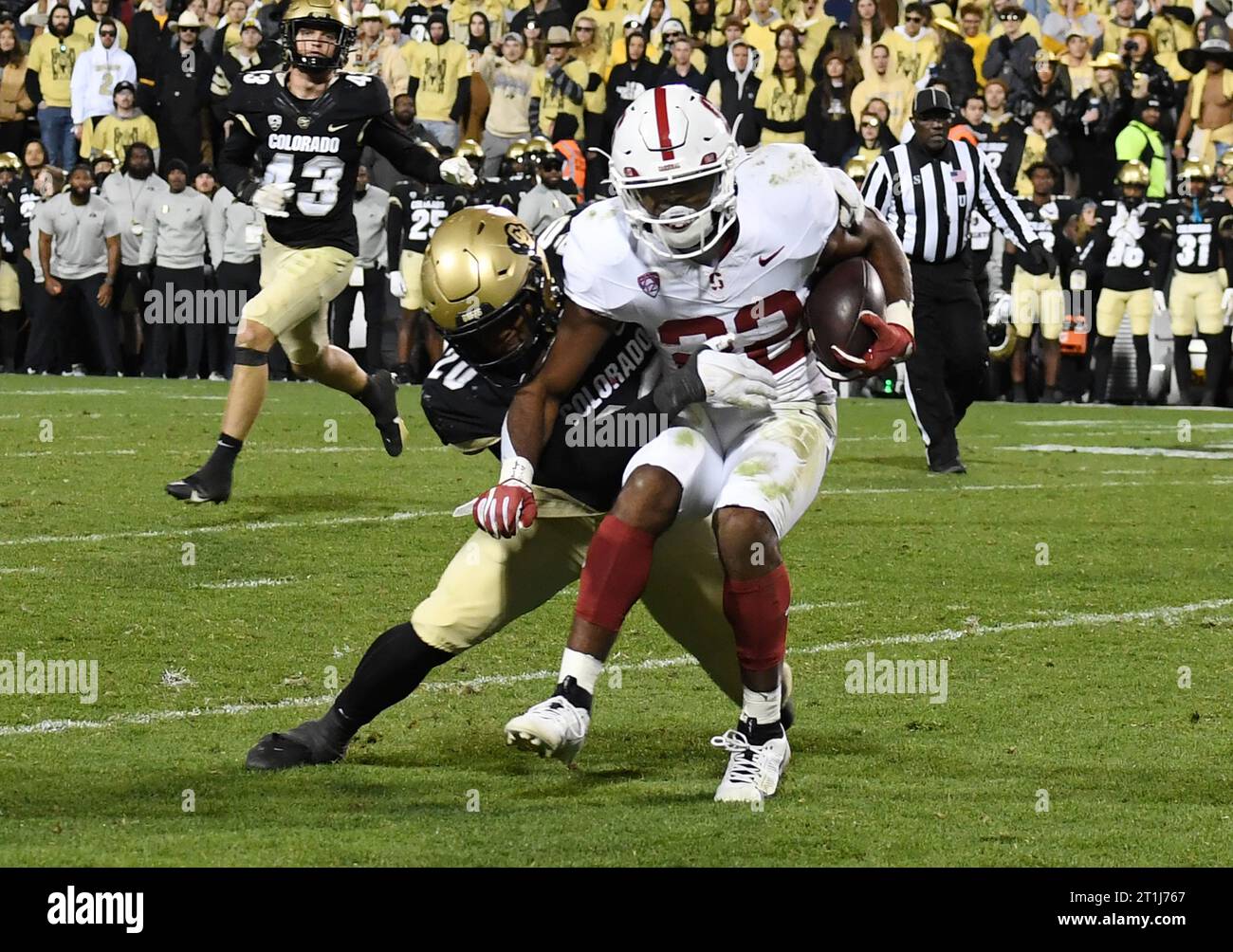 Boulder, United States. 14th Oct, 2023. Colorado's LaVonta Bentley (20) tackles Stanford's E.J. Smith (22) after a gain during game at Folsom Field in Boulder, Colorado on Friday, October 13, 2023. Stanford won 46-43. Photo by Kate Benic/UPI Credit: UPI/Alamy Live News Stock Photo
