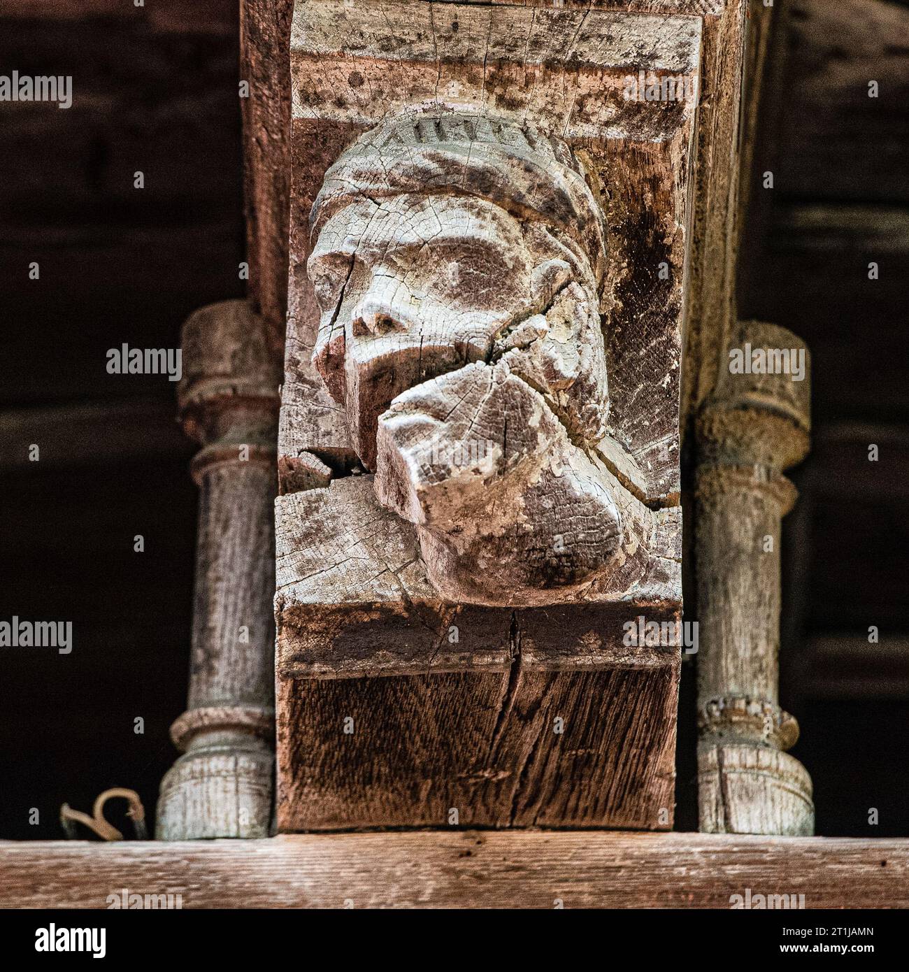 A medieval carved wooden beam in the town of Mirepoix, Aude Stock Photo