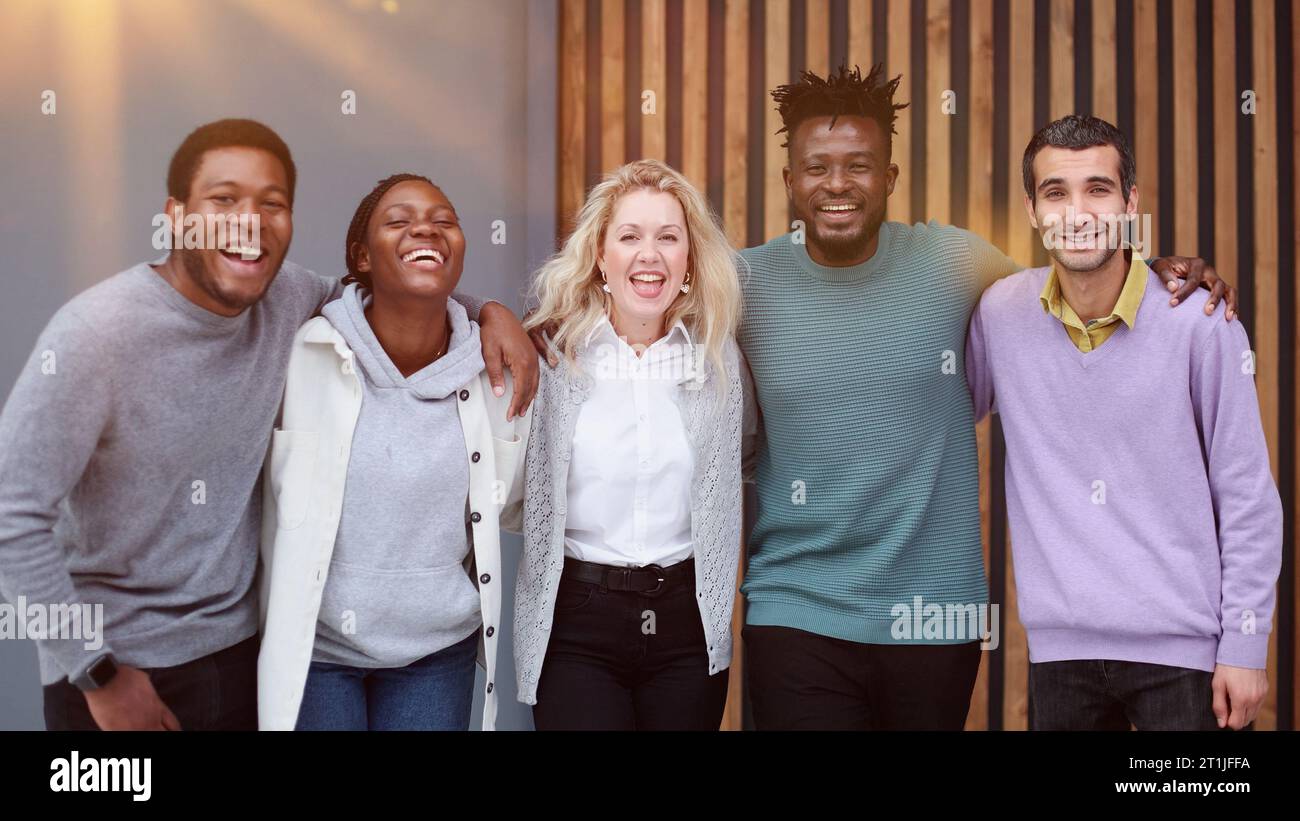 Business team consisting of young business people standing side by side ...