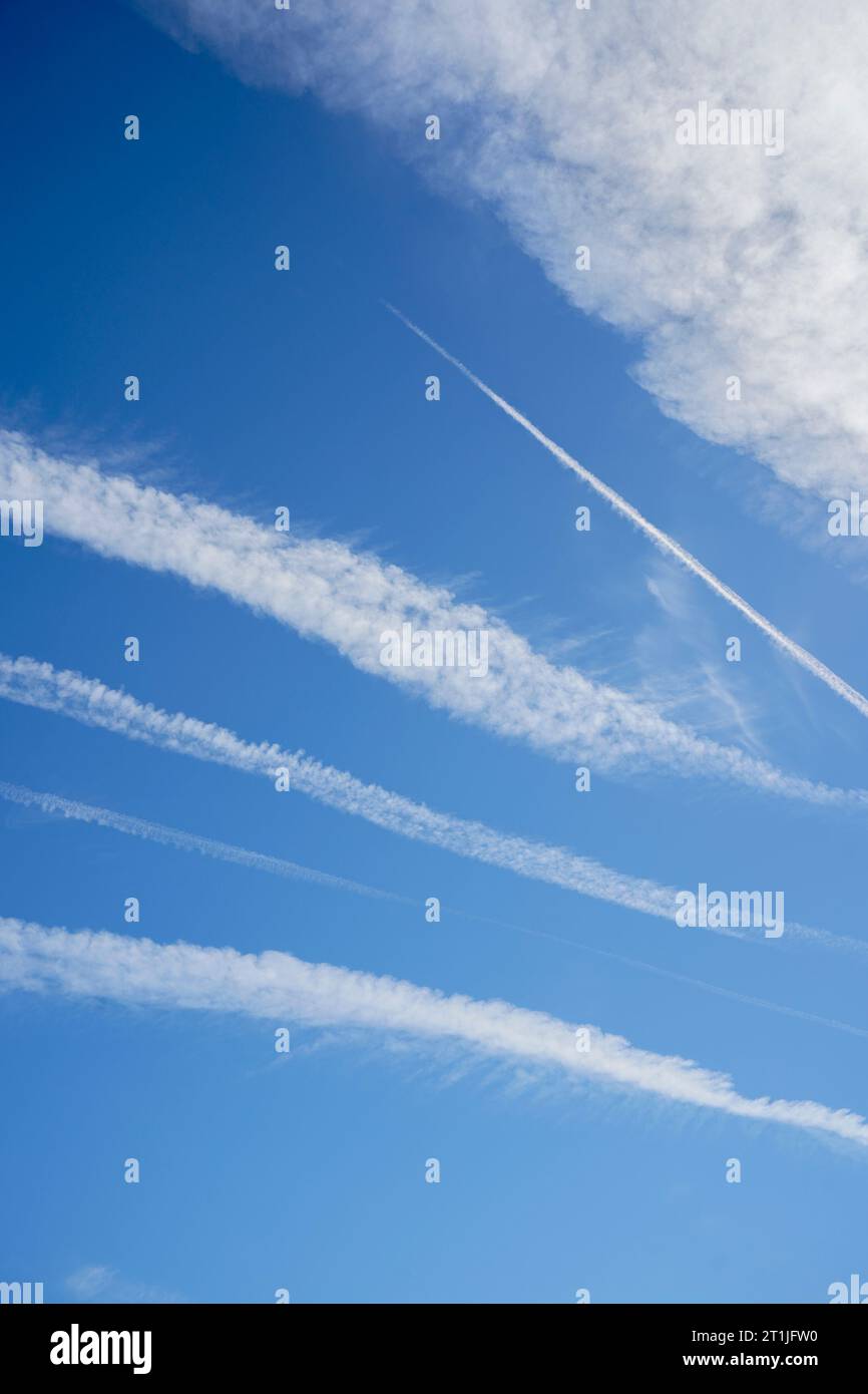 Airplane vapour trails across a deep blue sky, Spain. Stock Photo