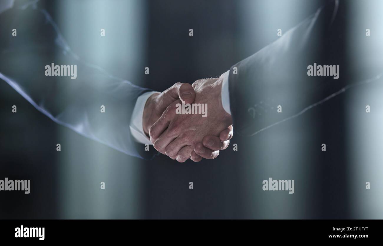 Close-up image of handshake between two colleagues. Stock Photo