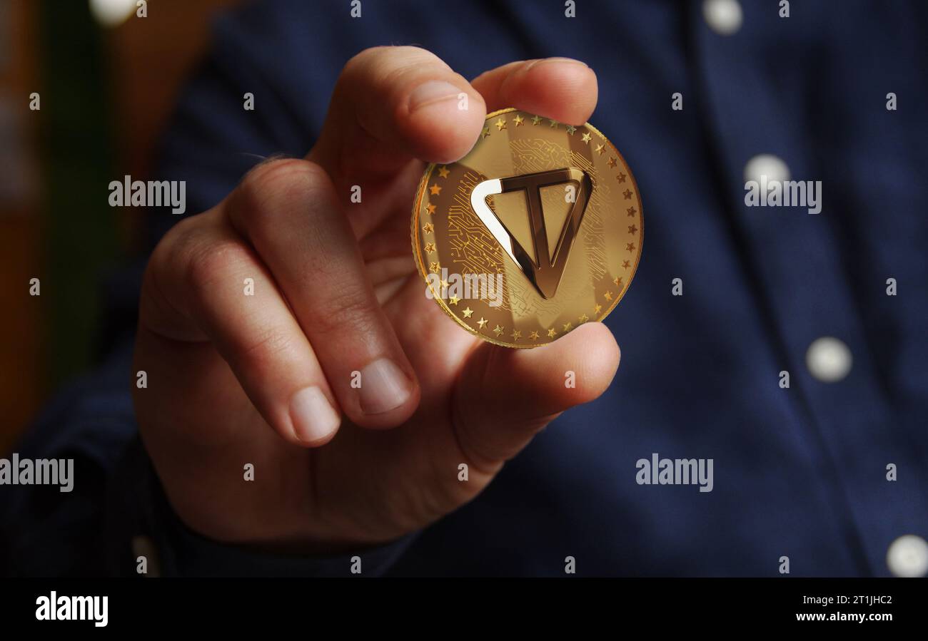 Toncoin TON cryptocurrency golden coin in hand abstract concept Stock Photo  - Alamy