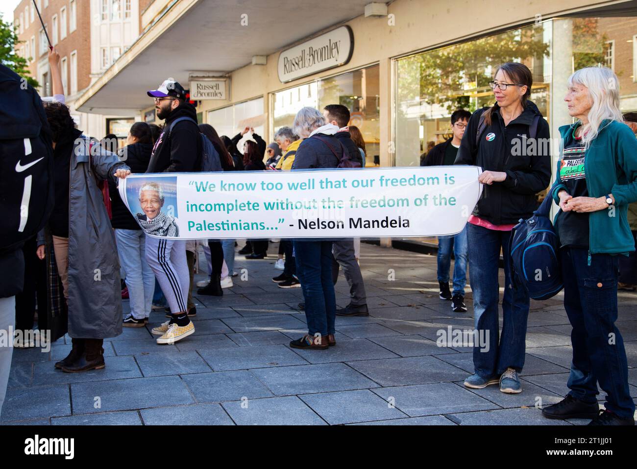 Free Palestine protest Exeter city centre - Nelson Mandela image and quote banner Stock Photo