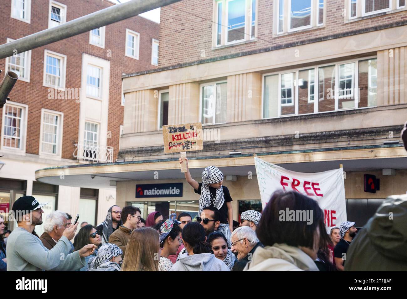 Israel is killing children like me young protestor with face hidden by scarf Stock Photo