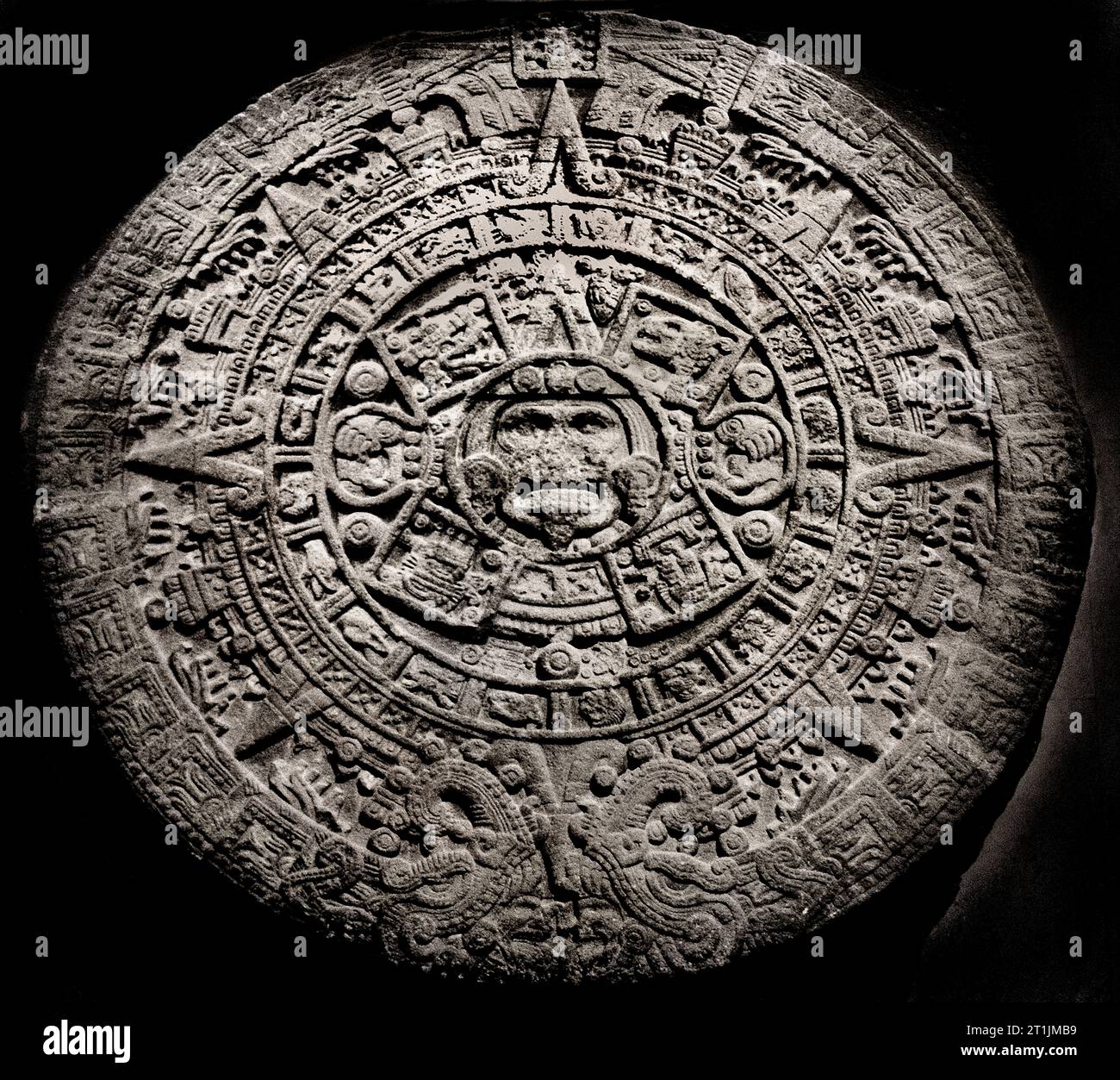 Aztec Stone of the Sun, The Aztec calendar stone, Sun stone, or Stone of the Five Eras is a late post-classic Mexican sculpture saved in the National Anthropology Museum, Mexico City and is perhaps the most famous work of Aztec sculpture. Circa 15th century. Stock Photo