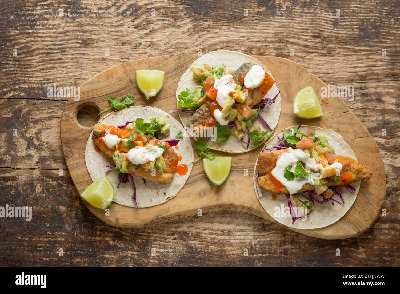 Mackerel tacos made with fresh fried mackerel, Scomber scombrus, served with salsa and soured cream. Dorset England UK GB Stock Photo