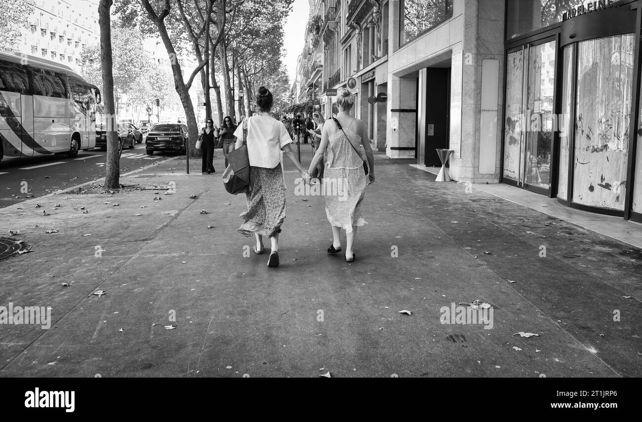 Female couple walking in St. Germain, holding hands Stock Photo Alamy