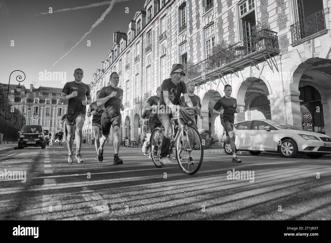 France Rugby team in warm-up, plus one bicyclist. Paris, France Stock Photo
