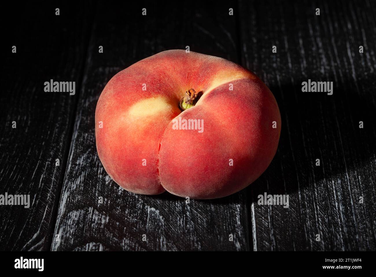 flat peach on wood background Stock Photo