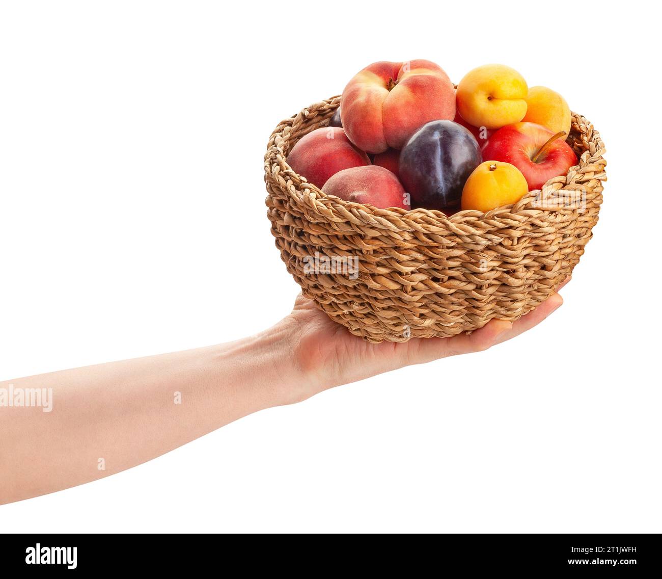 fruit mix basket in hand path isolated on white Stock Photo