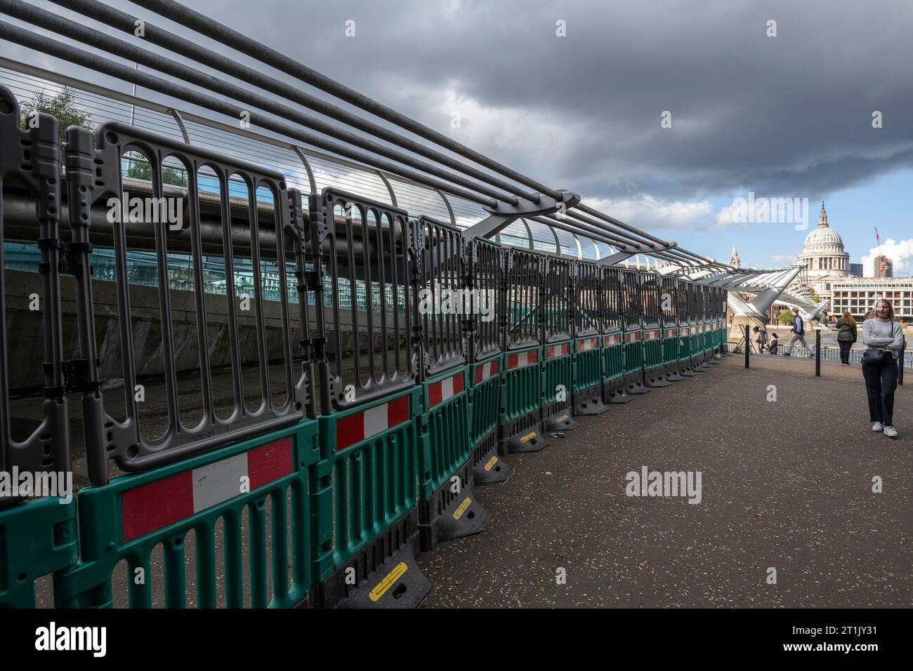 London, UK.  14 October 2023.  Safety barriers are up as the Millennium Bridge has closed for maintenance.  City Bridge Foundation, a charity that looks after London's major Thames crossings, says that a layer of membrane has started to degrade and needs replacing.  Repairs will take three weeks.  Credit: Stephen Chung / Alamy Live News Stock Photo