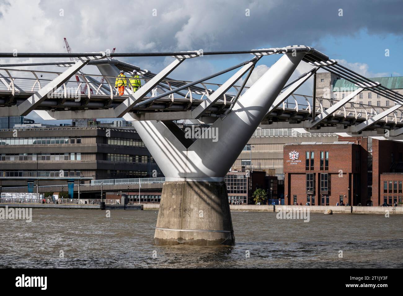 London, UK.  14 October 2023.  Workmen cross the Millennium Bridge which has closed for maintenance.  City Bridge Foundation, a charity that looks after London's major Thames crossings, says that a layer of membrane has started to degrade and needs replacing.  Repairs will take three weeks.   Credit: Stephen Chung / Alamy Live News Stock Photo