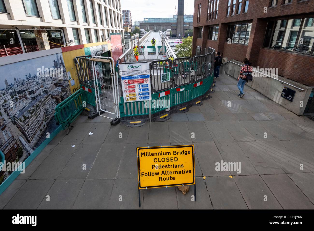 London, UK.  14 October 2023.  Members of the public pass signage informing them that the Millennium Bridge has closed for maintenance.  City Bridge Foundation, a charity that looks after London's major Thames crossings, says that a layer of membrane has started to degrade and needs replacing.  Repairs will take three weeks.  Credit: Stephen Chung / Alamy Live News Stock Photo