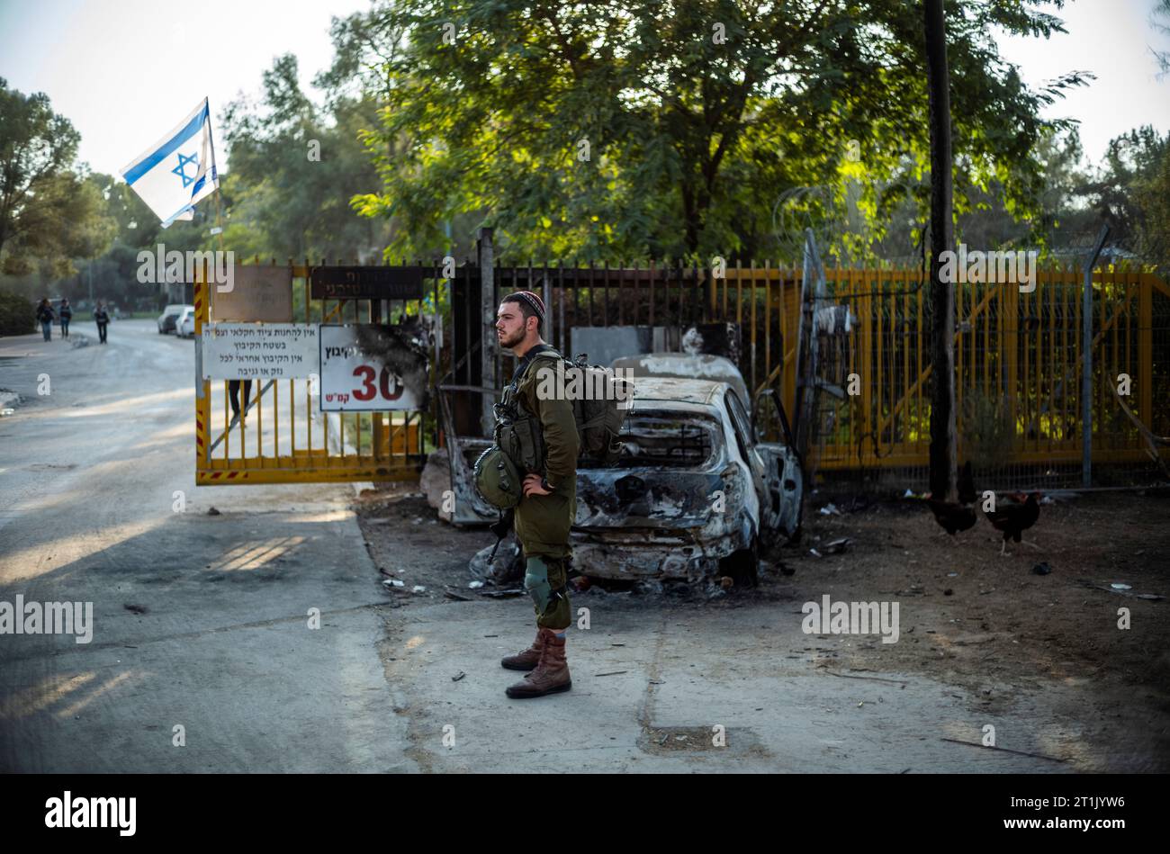 14 October 2023, Israel, Be·eri: An Israeli soldier patrols the area in ...
