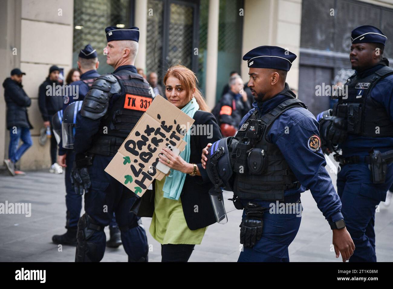 Paris, France. 14th Oct, 2023. Riot police arrest a protester during a ...