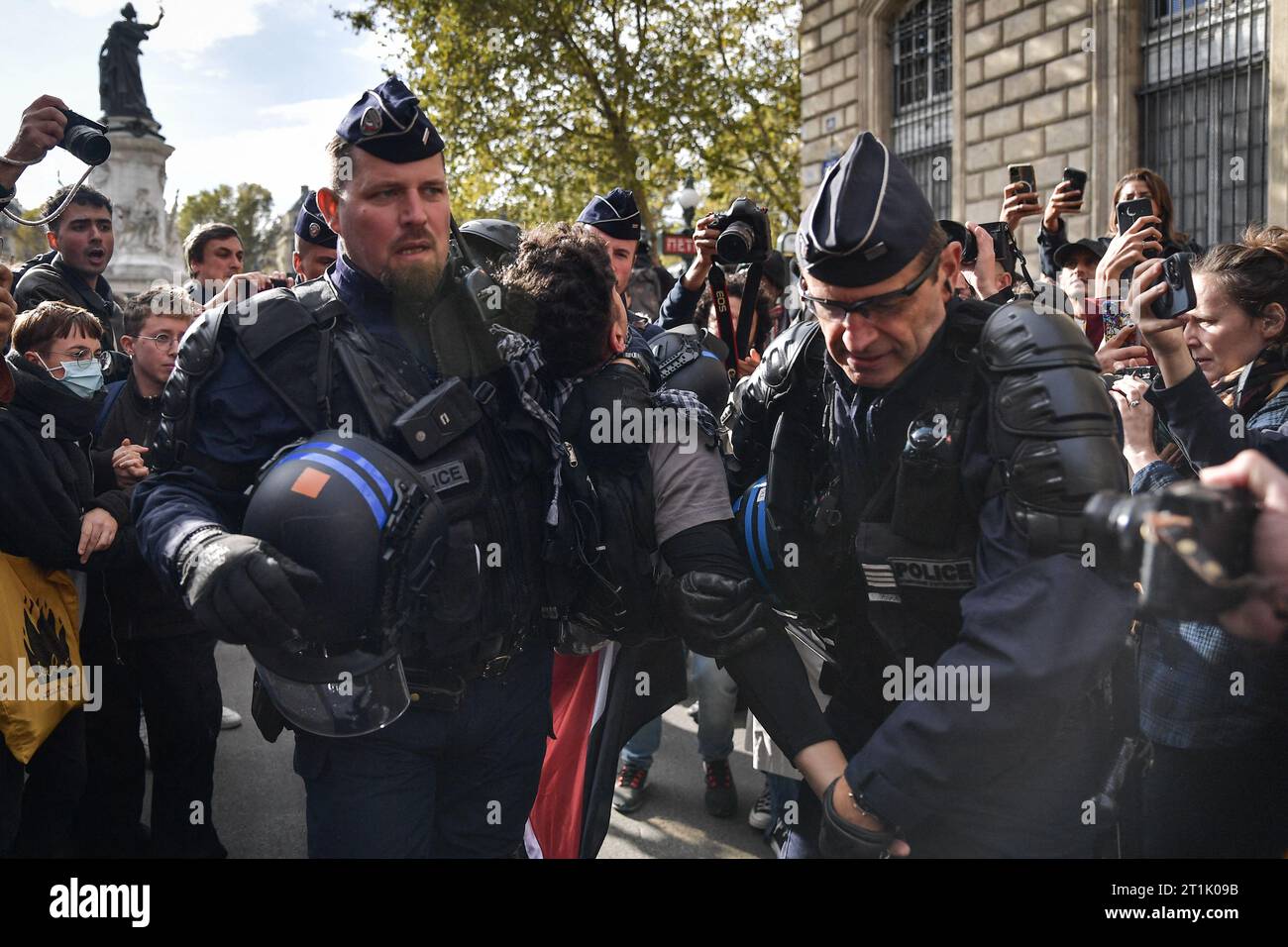 Paris, France. 14th Oct, 2023. Riot police arrest a protester during a ...