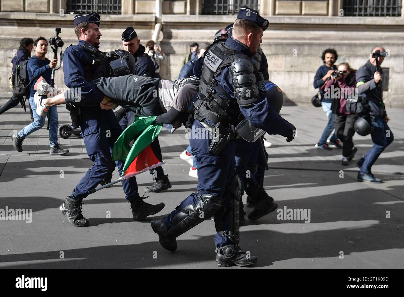 Paris, France. 14th Oct, 2023. Riot police arrest a protester during a ...
