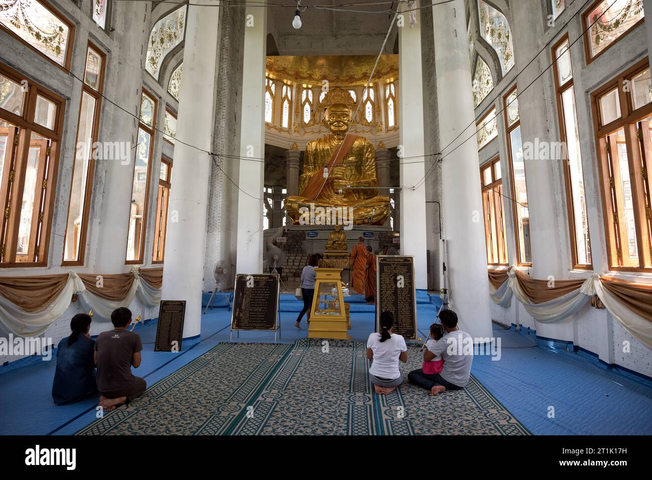 Sikhio, Thailand - Jun 4, 2019: Pilgrims and prayers are paying respect to the highly famous monk statue cover by gold and have a name 'Somdet Phra Bu Stock Photo